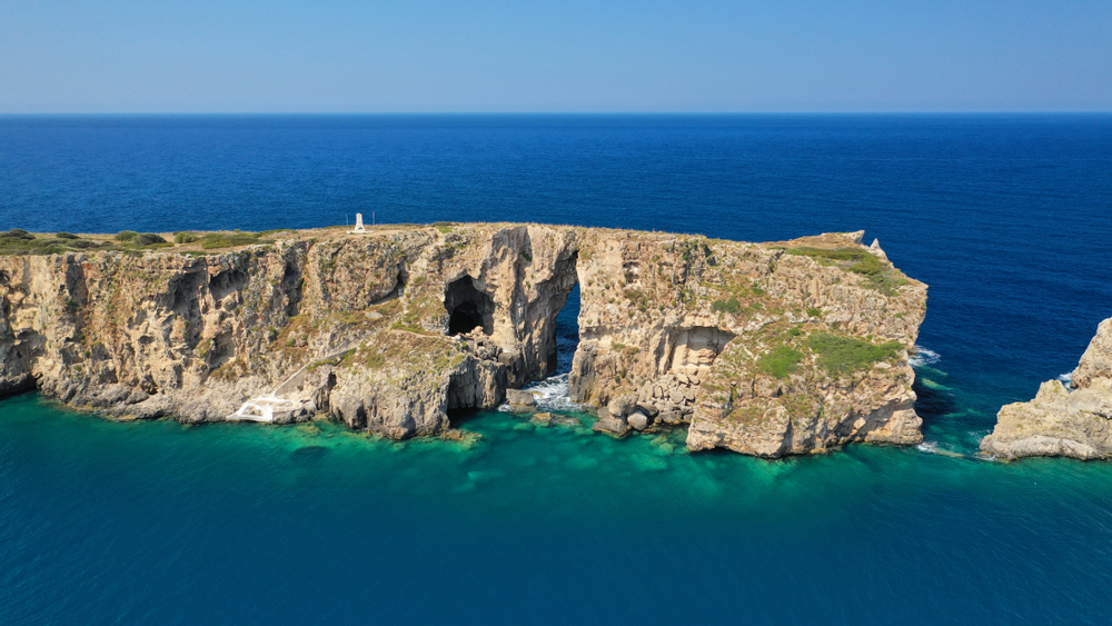 Islet Of Pilos And Iconic Rocky Arch