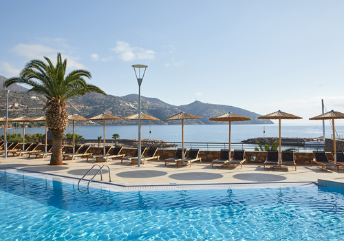 Pool with beach view at Wyndham Grand Crete Mirabello Bay