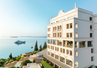 On the beachfront overlooking a private cove at Eva Palace Grecotel Beach Luxe Resort