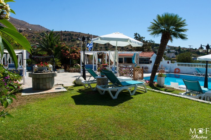 View of sunbeds by the pool at Saraya Resort in Leros