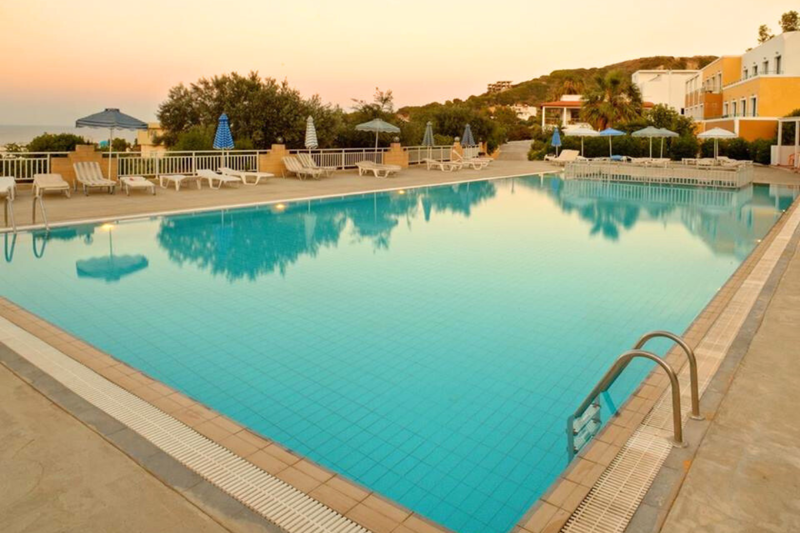 Pool view at dusk in Hermes Hotel in Kos