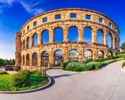 Pula, Croatia. Summer Scenic View Of Ancient Ruins Roman Amphitheatre In Pula, Istria Croatian Region.