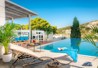 Swimming Pool and Sunbed Area at Hotel Uvala